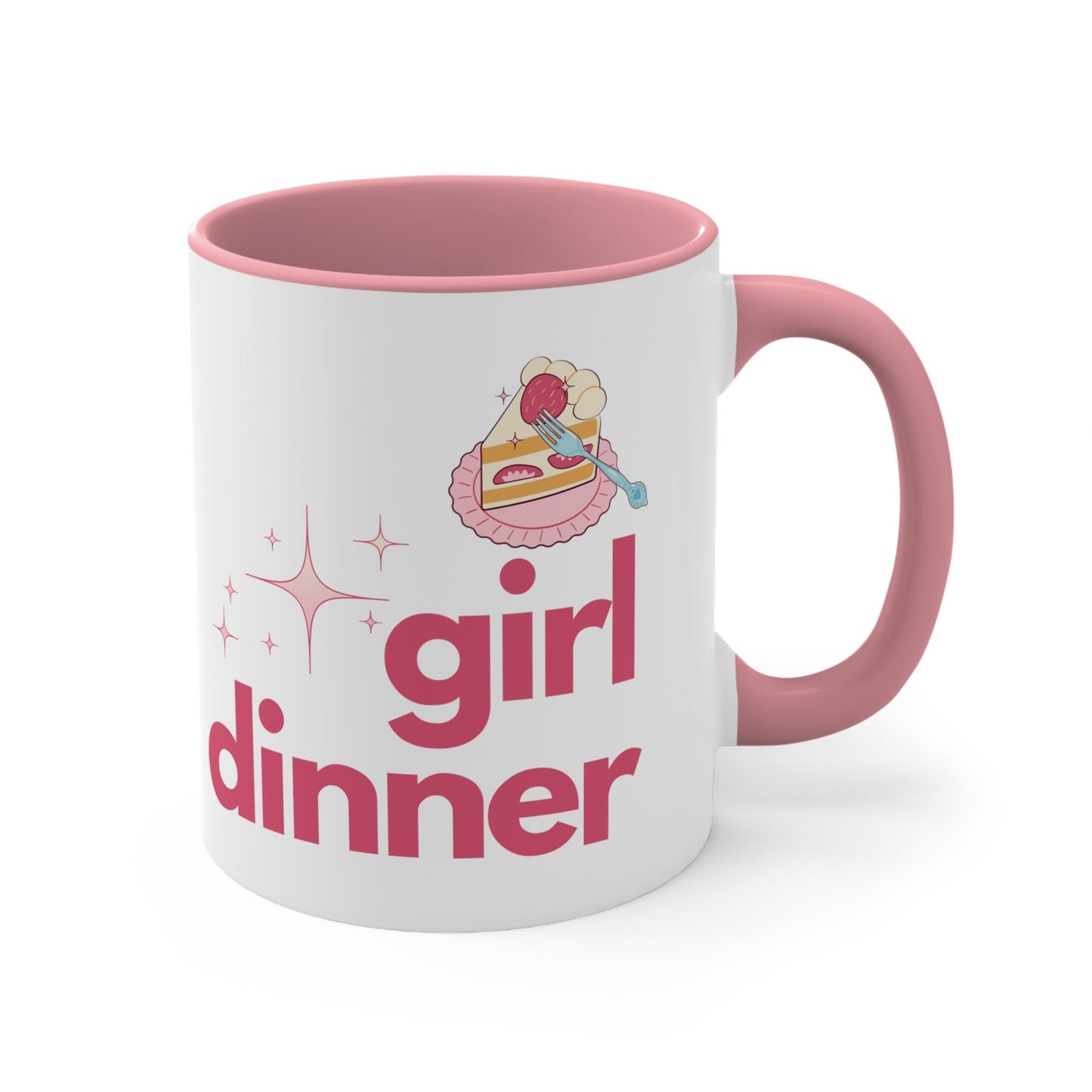 A White and Pink mug that reads &quot;Girl Dinner&quot;. Design features Pink lowercase fonts and a slice of Kawaii strawberry cake.